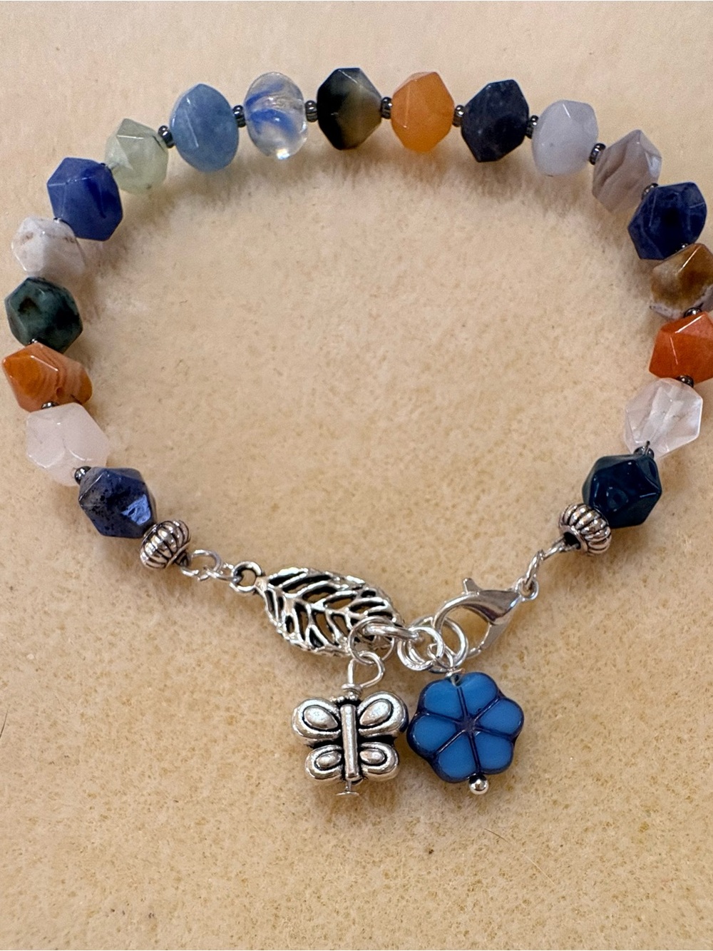 Multicolor Faceted Gemstone Bracelet with Blue Flower Butterfly Charms